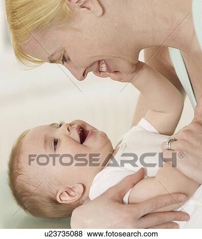 Mother and Baby Boy Looking at Each Other View Large Photo Image Stock Photo - Mother and Baby Boy Looking at Each Other. Fotosearch