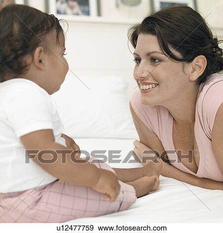 Stock Photo - Mother and baby girl (1-2. Fotosearch