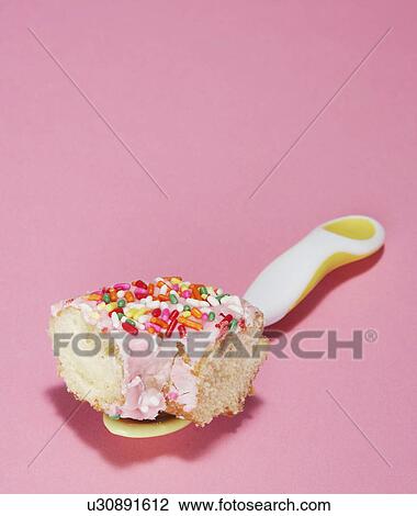 Piece of Doughnut on Spoon View Large Photo Image Stock Image - Piece of Doughnut on Spoon. Fotosearch
