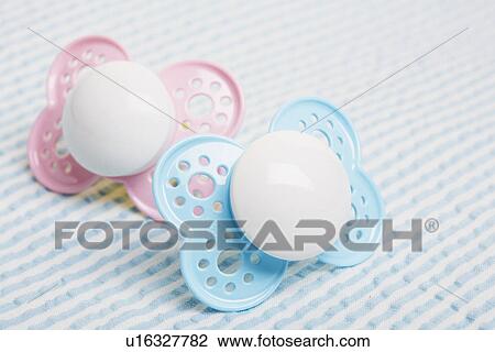 Pink and blue pacifiers View Large Photo Image Stock Image - Pink and blue pacifiers. Fotosearch