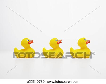 Three rubber ducks in row View Large Photo Image Stock Image - Three rubber ducks in row. Fotosearch