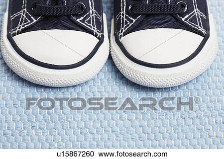 Stock Image - Two baby sneakers (close-up). Fotosearch