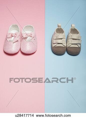 Picture - Two Pairs of Baby Shoes. Fotosearch