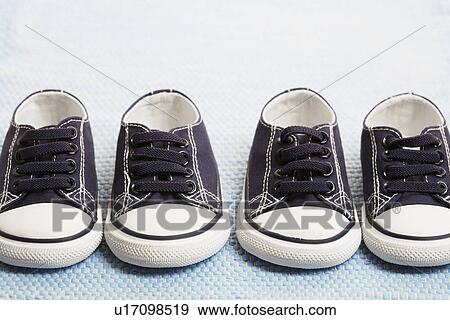 Stock Photo - Two pairs of blue baby sneakers. Fotosearch