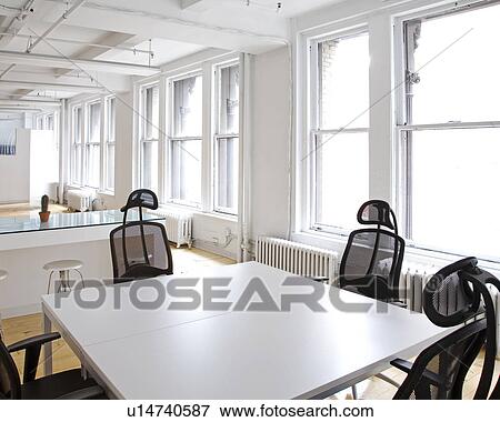 Stock Photo - Empty Table and Chairs in Office. Fotosearch