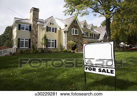 Stock Image - "For Sale" sign near house, Chatham, New Jersey, USA. Fotosearch