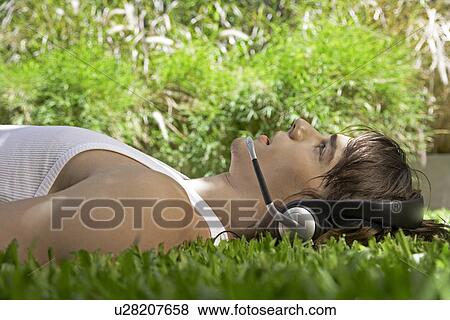 Stock Photo - Young Man Talking Through Headset. Fotosearch