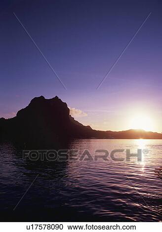 Stock Image - The Morning Sun And A Mountain. Fotosearch