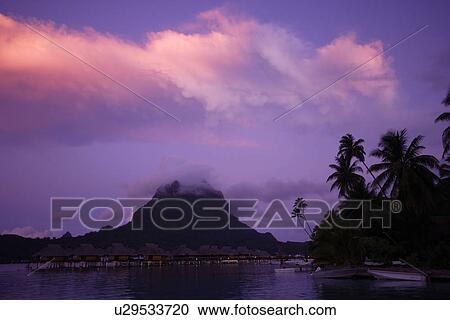 Stock Image - Twilight In The Bora Bora Island. Fotosearch