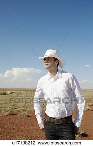 Young man in cowboy attire, Arizona, USA View Large Photo Image Stock Image - Young man in cowboy attire, Arizona, USA. Fotosearch