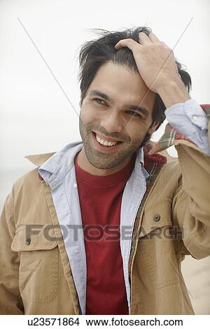 Picture - Young man laughing. Fotosearch