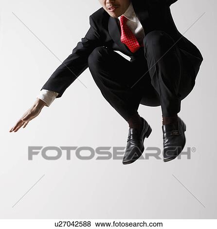 Stock Photo - Businessman Jumping. Fotosearch