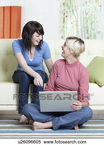 Two Young Women Using Laptop View Large Photo Image Stock Photography - Two Young Women Using Laptop. Fotosearch