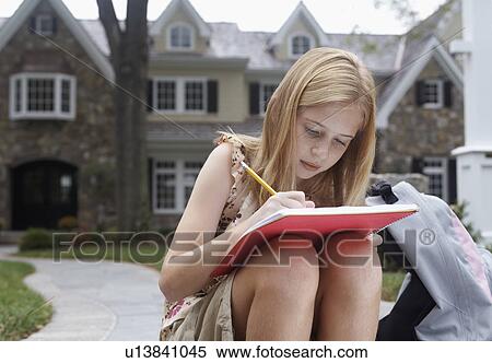 Girl (10-11) doing homework near house, Chatham, New Jersey, USA View Large Photo Image Stock Photography - Girl (10-11) doing homework near house, Chatham, New Jersey, USA. Fotosearch