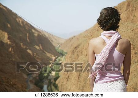 Stock Photograph - Woman Looking at Gorge. Fotosearch