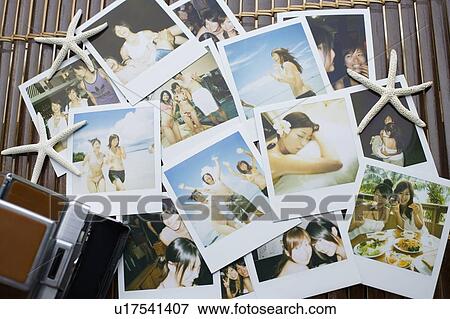 Stock Photo - Stack of photographs of vacation, Saipan, USA . Fotosearch