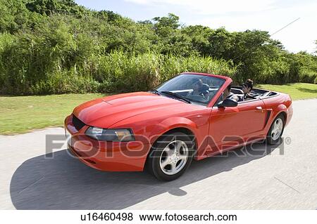 Stock Photo - Young people in the car, Saipan, USA . Fotosearch
