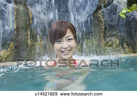 Young woman in a swimming pool, Saipan  View Large Photo Image Stock Photo - Young woman in a swimming pool, Saipan . Fotosearch