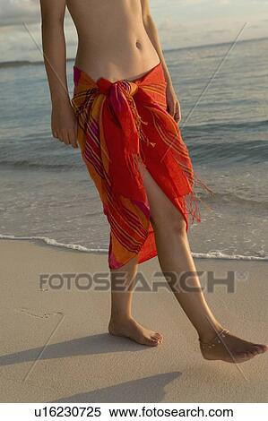 Young woman walking on beach, Saipan, USA View Large Photo Image Stock Photography - Young woman walking on beach, Saipan, USA . Fotosearch
