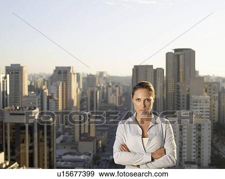 Businesswoman, city in background (portrait) View Large Photo Image Stock Photo - Businesswoman, city in background (portrait). Fotosearch