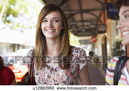 Teenage girl laughing with her friends View Large Photo Image Stock Image - Teenage girl laughing with her friends. Fotosearch