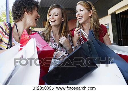 Three teenage girls with shopping bags View Large Photo Image Stock Photography - Three teenage girls with shopping bags. Fotosearch