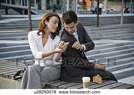 Stock Photo - Well-Dressed Couple Having Lunch. Fotosearch