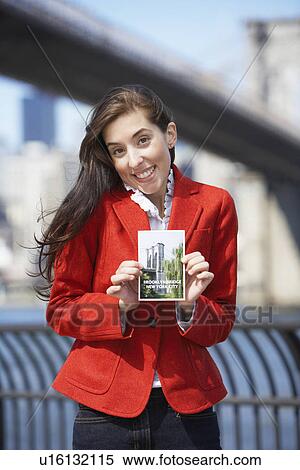 Woman holding Brooklyn Bridge postcard, New York City, New York, USA View Large Photo Image Stock Photography - Woman holding Brooklyn Bridge postcard, New York City, New York, USA. Fotosearch