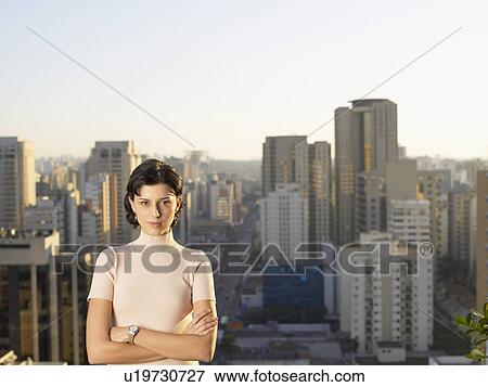 Stock Photo - Young woman, city in background, Sao Paolo, Brazil. Fotosearch