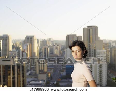 Young woman, city in background (portrait), Sao Paolo, Brazil View Large Photo Image Stock Image - Young woman, city in background (portrait), Sao Paolo, Brazil. Fotosearch