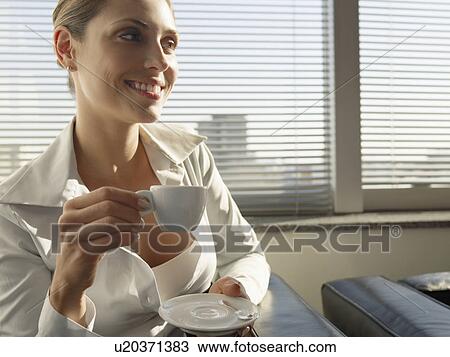 Young woman drinking coffee View Large Photo Image Stock Image - Young woman drinking coffee. Fotosearch