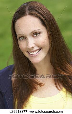 Stock Photo - Young woman smiling (portrait). Fotosearch