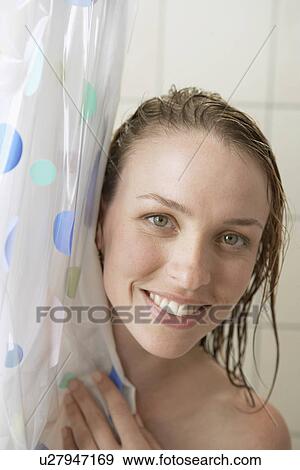 Stock Photo - Young woman in shower (portrait). Fotosearch