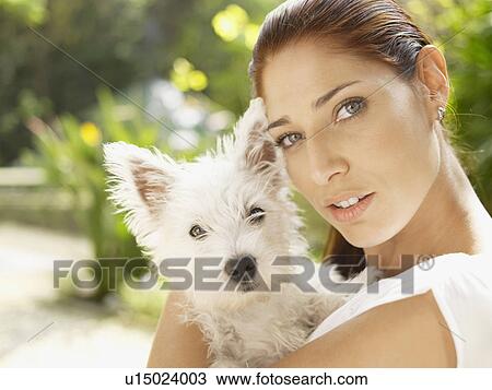 Woman holding poodle (portrait) View Large Photo Image Stock Image - Woman holding poodle (portrait). Fotosearch