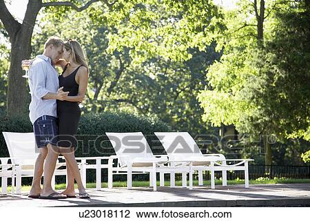 Couple dancing by pool View Large Photo Image Stock Image - Couple dancing by pool. Fotosearch