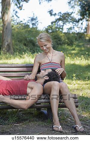 Young Couple on Bench View Large Photo Image Stock Image - Young Couple on Bench. Fotosearch