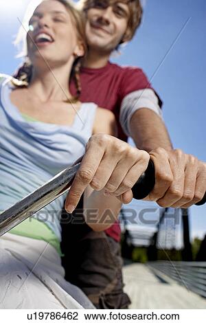 Young Couple Riding Bicycle View Large Photo Image Stock Image - Young Couple Riding Bicycle. Fotosearch
