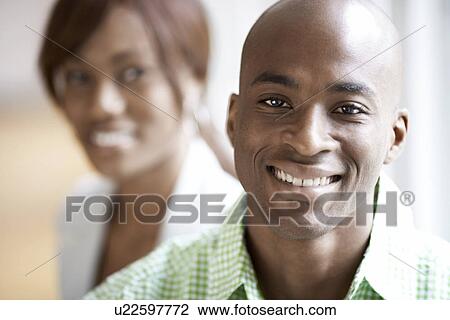 Man and woman smiling (portrait) View Large Photo Image Stock Image - Man and woman smiling (portrait). Fotosearch