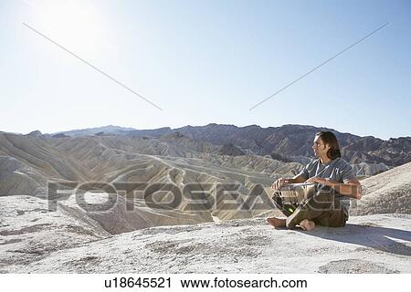 Man playing drums in desert, Death Valley, California, USA View Large Photo Image Stock Image - Man playing drums in desert, Death Valley, California, USA. Fotosearch
