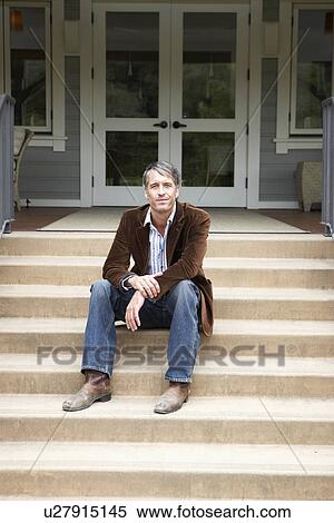 Man sitting on steps View Large Photo Image Stock Photography - Man sitting on steps. Fotosearch