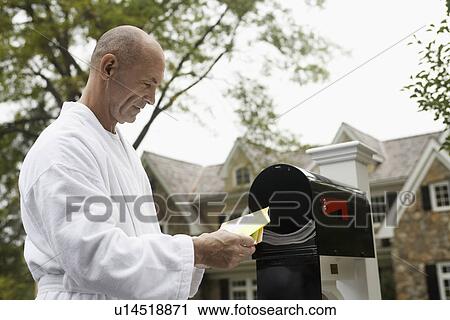 Mature man going through mail, Chatham, New Jersey, USA View Large Photo Image Stock Image - Mature man going through mail, Chatham, New Jersey, USA. Fotosearch