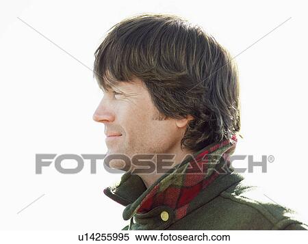 Stock Photography - Mid adult man in warm jacket, portrait. Fotosearch