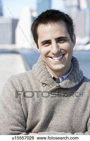 Stock Photograph - Man in sweater (portrait). Fotosearch