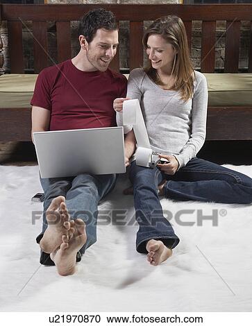 Stock Image - Couple Managing Finance. Fotosearch