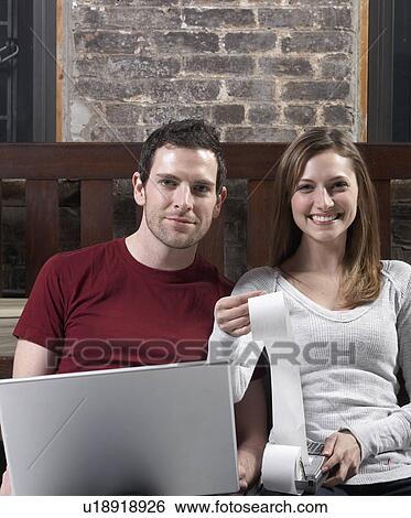 Stock Photograph - Couple Managing Finance. Fotosearch