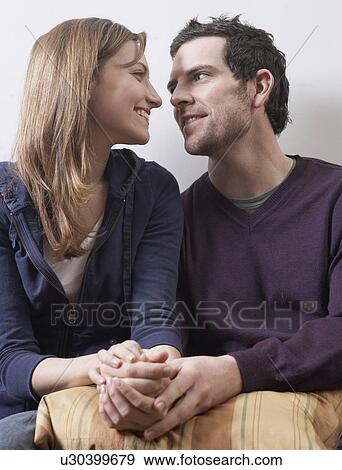 Stock Photo - Mid-Adult Couple Holding Hands. Fotosearch