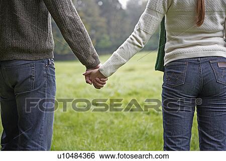 Mid Adult Couple Holding Hands View Large Photo Image Stock Photograph - Mid Adult Couple Holding Hands. Fotosearch