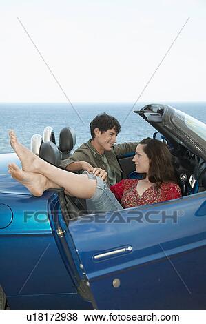 Stock Photo - Mid-Adult Couple in Convertible. Fotosearch
