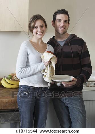 Picture - Mid-Adult Couple in Kitchen. Fotosearch