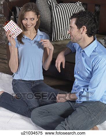 Mid-Adult Woman Receiving Gift from Boyfriend View Large Photo Image Stock Photography - Mid-Adult Woman Receiving Gift from Boyfriend. Fotosearch